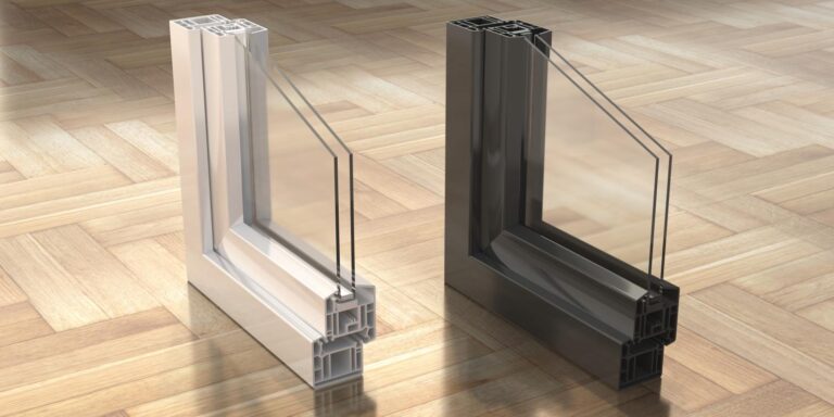 Double-glazed windows shown in cross-section. The panes are housed in aluminium profiles and encased in a PVC frame in two colours - white and black. The double-glazed windows shown are laid on the parquet floor.